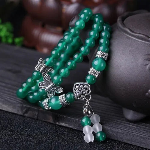 Green agate multi-layer women's bracelet with three circles of 6mm beads on an adjustable chain.