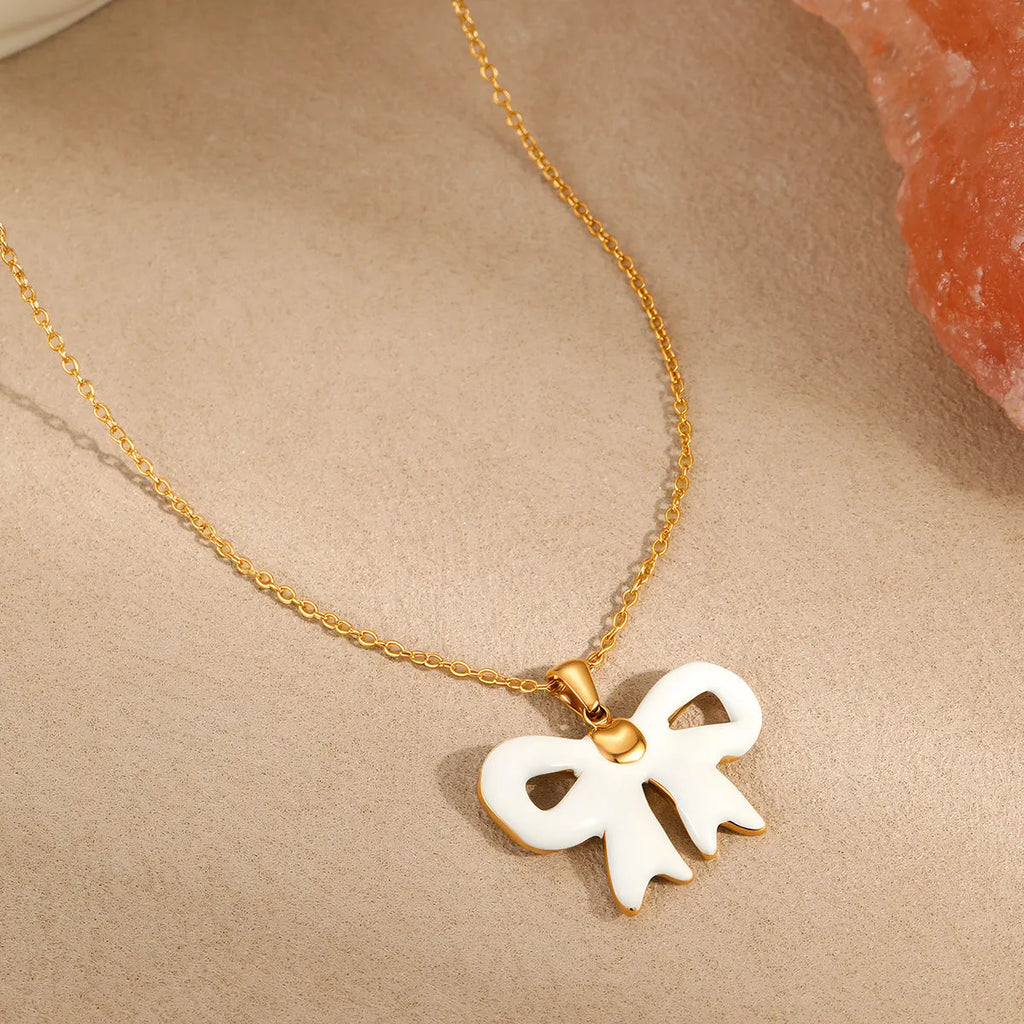 Bowknot white necklace with stainless steel pendant and electroplated finish on regular chain