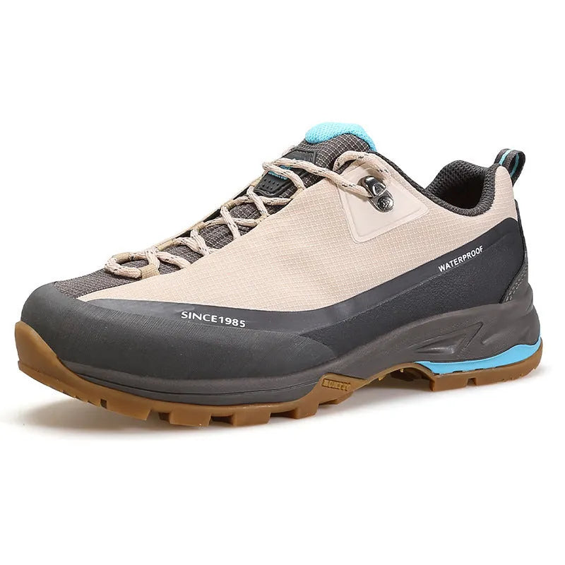 Men's low-top mountain climbing hiking boots in black with lace-up front and non-slip rubber sole.