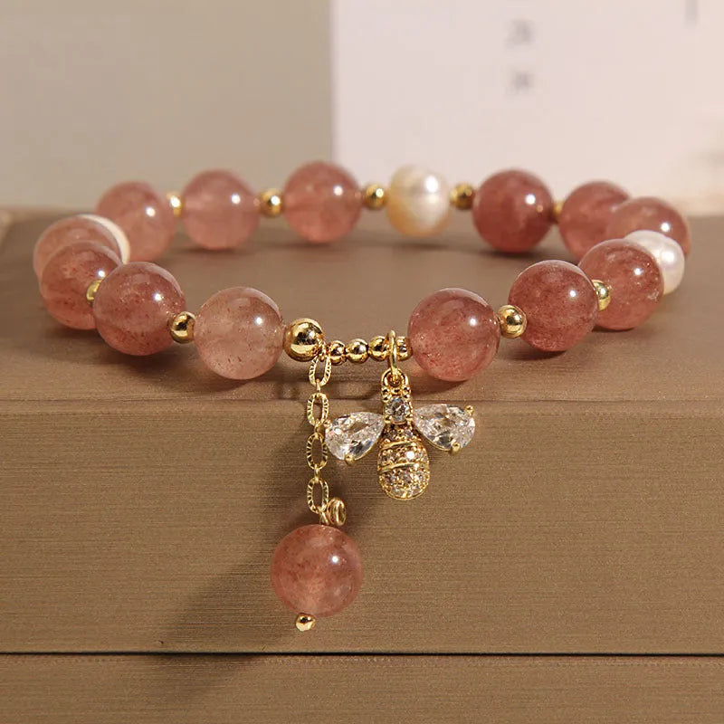 Women's bracelet with strawberry quartz beads, freshwater pearls, zircon details and an alloy clasp