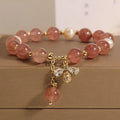 Women's bracelet with strawberry quartz beads, freshwater pearls, zircon details and an alloy clasp