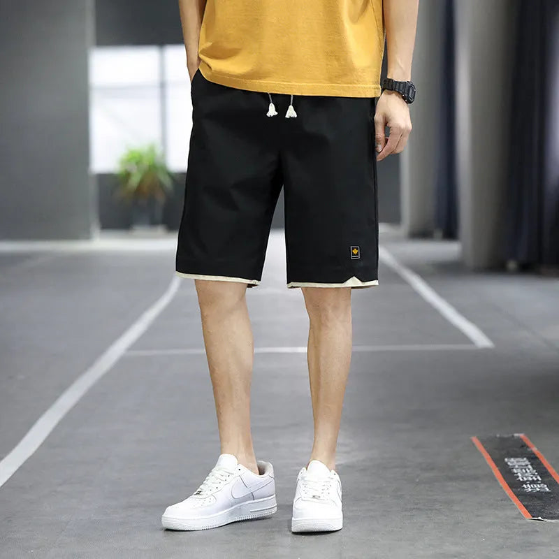 Man and woman modelling loose-fit casual beach shorts in South Korea style, available in multiple colours.