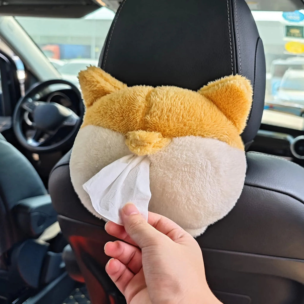Yellow corgi butt shaped car tissue box cover with elastic strap for sun visor mounting.