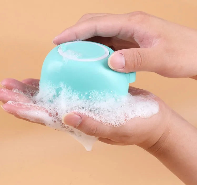 Blue silicone dog bath brush with soft bristles for washing and massage