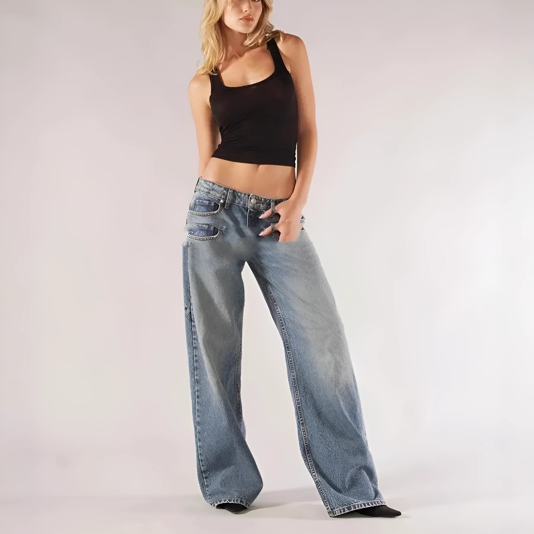 Blue loose straight wide leg cotton trousers with low waist and stitching detail on a model.
