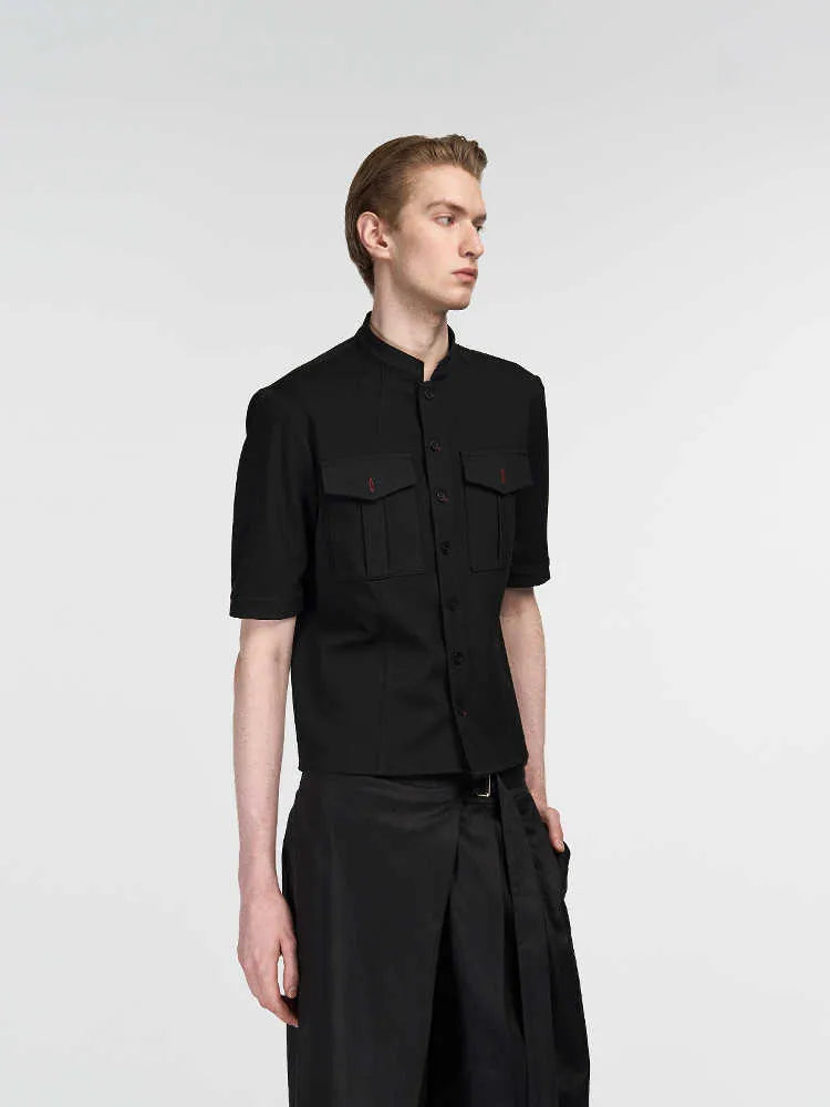 Black loose-fit half-sleeve hunting shirt with a shirt collar on a hanger.