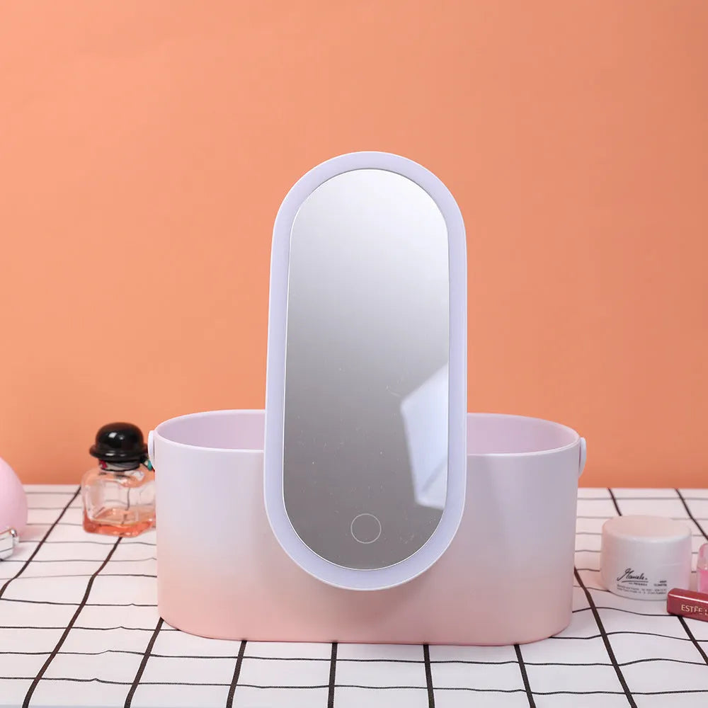 Pink portable LED makeup mirror case open, showing internal storage compartments and mirror.