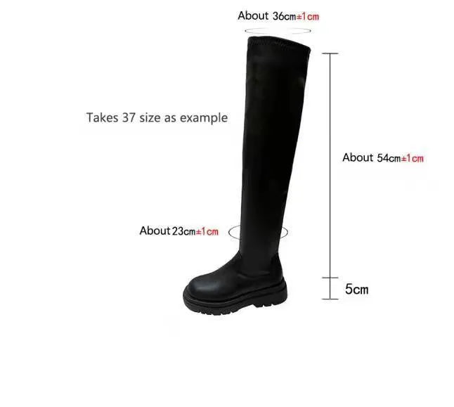 Black women's knee high boots with thick chunky sole and round toe on a winter background