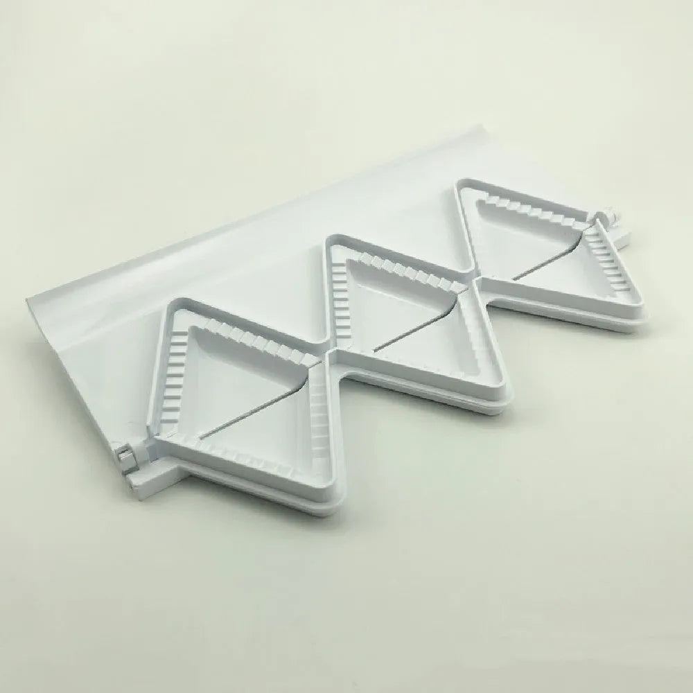 White plastic dumpling mold 28.5cm long on plain background