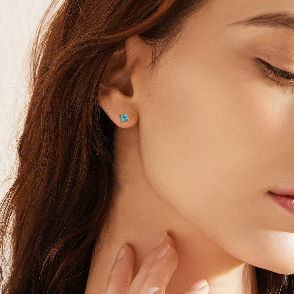 Brass gold-plated drop earring with a pear-shaped zircon stone in a candy colour.