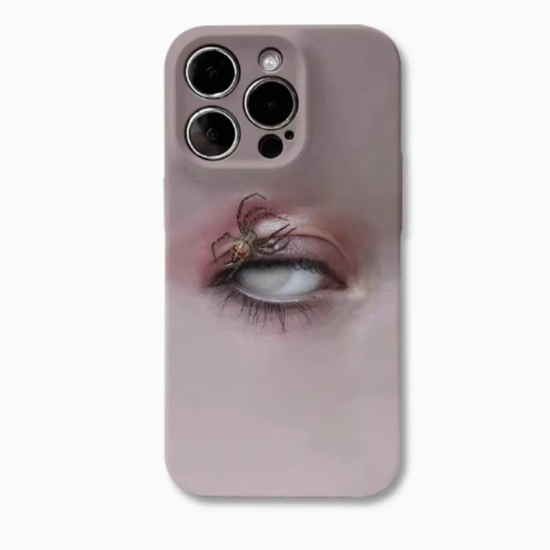 Dark frosted iPhone case with a spider web pattern, shown protecting a mobile phone.