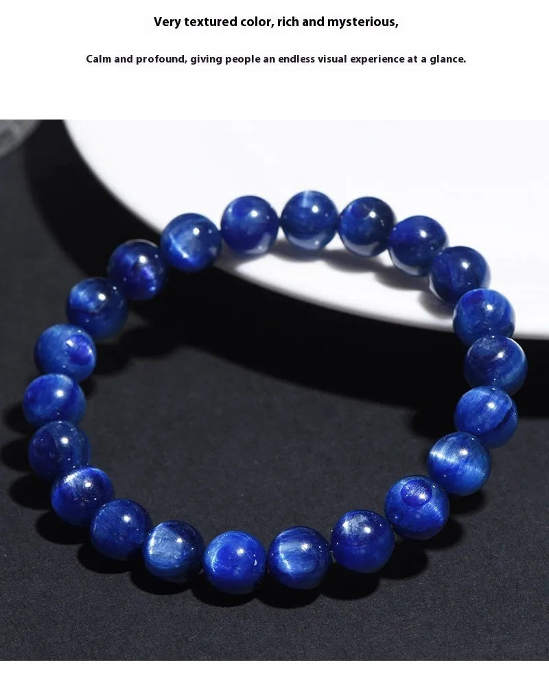 A polished blue crystal bracelet with geometry-shaped beads and a Ruyi charm on a single circle.