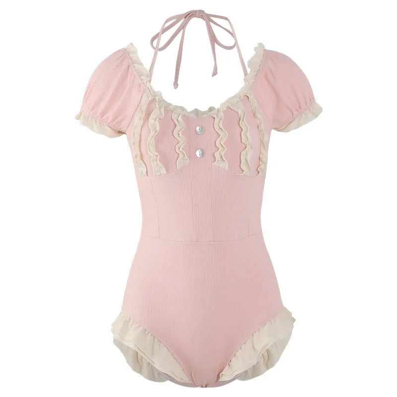 Women's pink conservative one-piece swimsuit with cute Siamese style design
