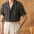Black 100% cotton men's short sleeve Cuban collar shirt with single-breasted placket and embroidered printed detailing