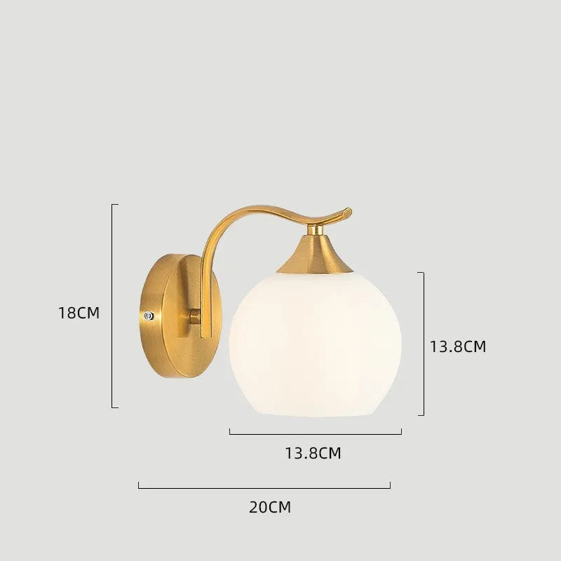Modern copper coloured wall lamp with glass lampshade for bedroom or hallway lighting