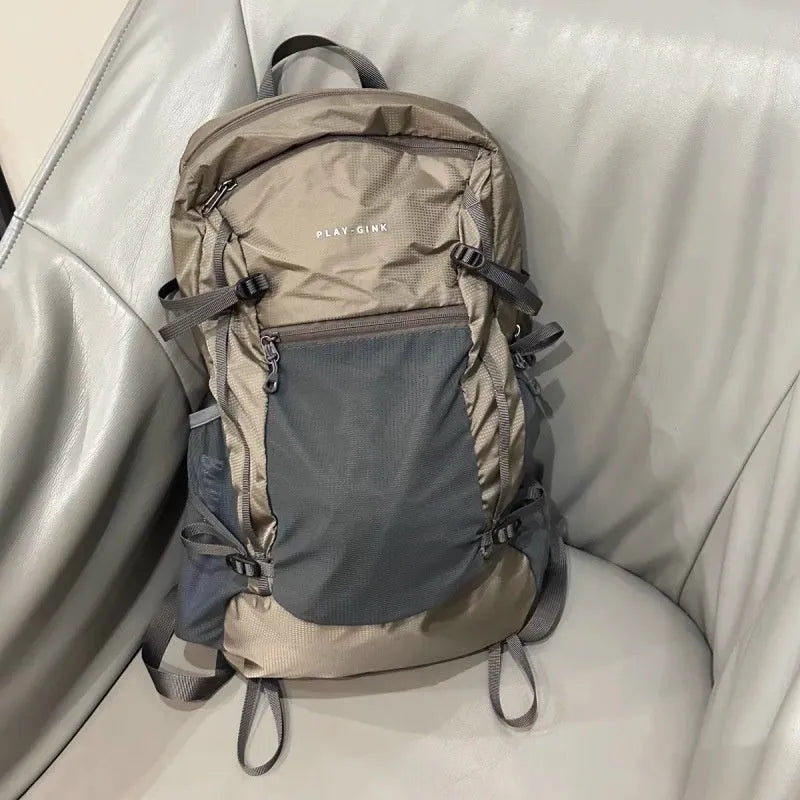 Lightweight waterproof nylon backpack 20-35L in natural Renaissance khaki light with curved shoulder straps and contrast colour detail