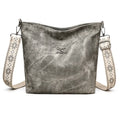 Soft PU leather crossbody shoulder bag in pink colour with large main compartment and single strap