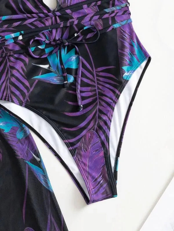 Women's three-piece bikini swimsuit set in a multicolour pattern with a matching cover-up coat.