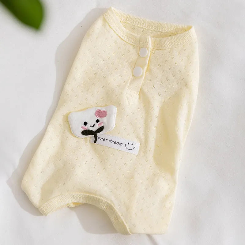 Pet shirt in soft yellow mesh fabric with cat patches and button closure on white background