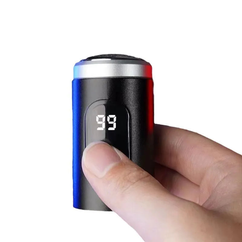 Black mini portable rechargeable electric shaver with USB cable and cleaning brush on a white background.
