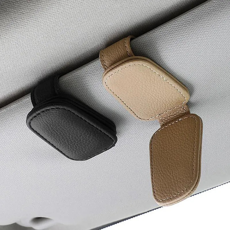 PU leather car sunglasses holder clip attached to a sun visor in beige colour