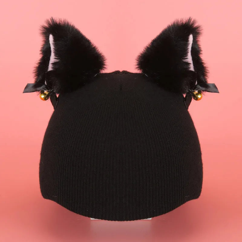 Soft plush cartoon character cover stretched over a pair of black on-ear headphones.