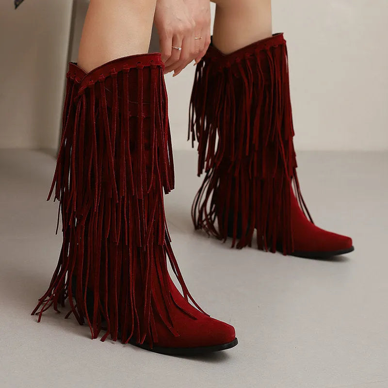 Women's black suede high boots with tassels, a chunky heel, and a waterproof platform.