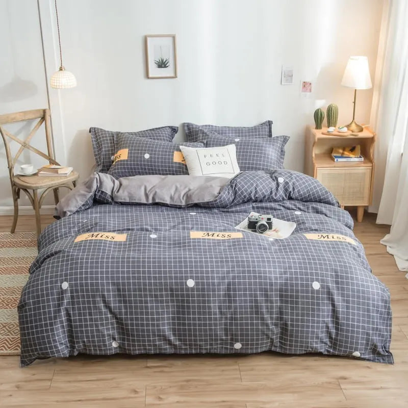 Cotton duvet cover and fitted sheet bedding set in a colour option, shown on a bed