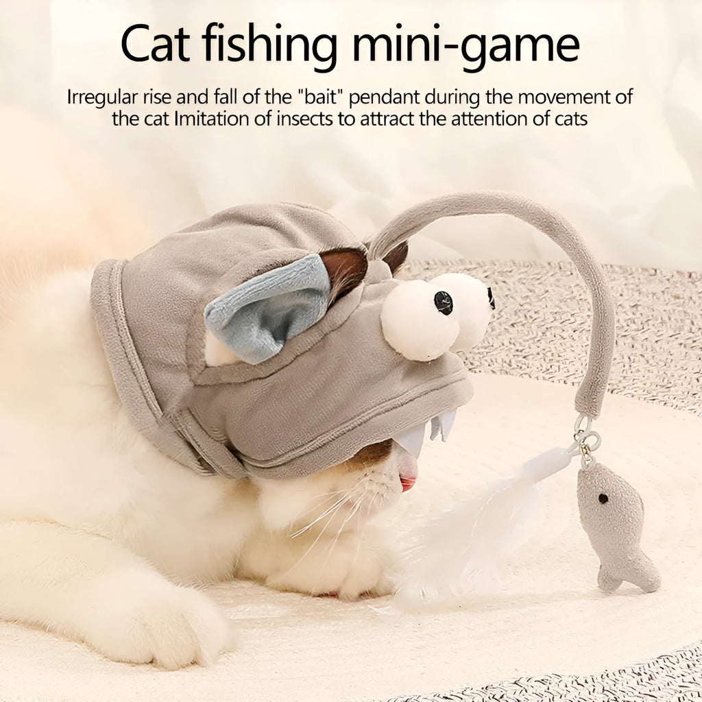 Grey dinosaur-themed cat headband toy with big eyes, a feather teaser, and an adjustable strap for hands-free play.
