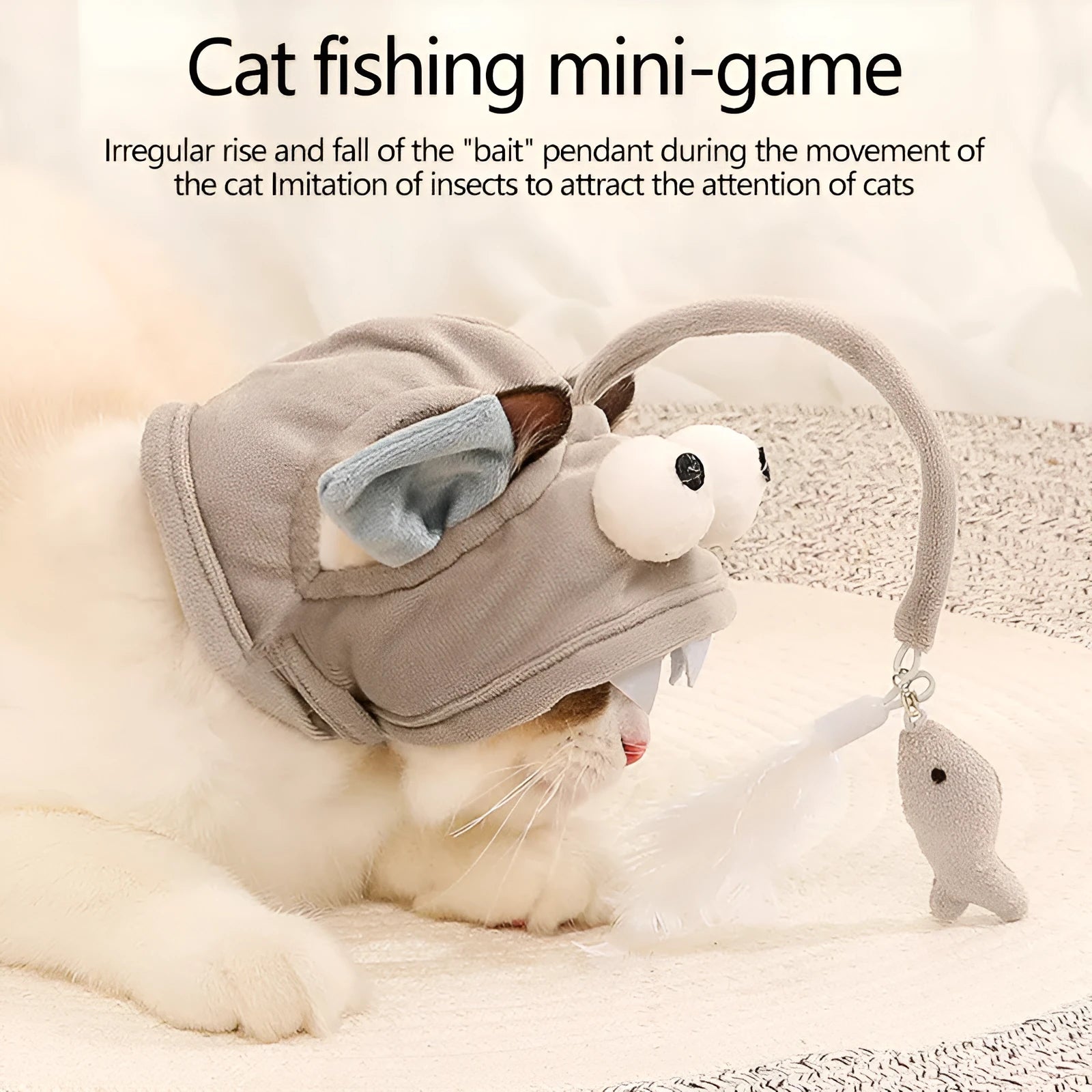 Grey dinosaur-themed cat headband toy with big eyes, a feather teaser, and an adjustable strap for hands-free play.