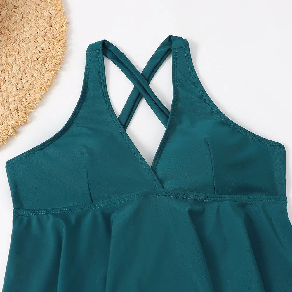 Peacock blue polyester high waist bikini set with ribbon detail on woman at beach