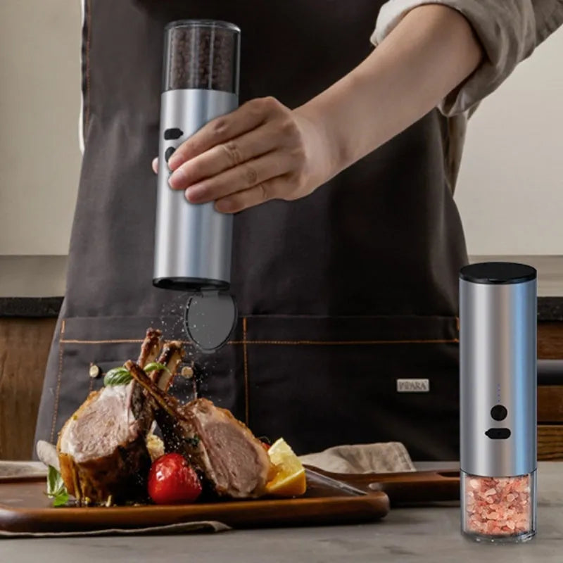 White and black electric salt and pepper grinders with USB port and clear glass jars.