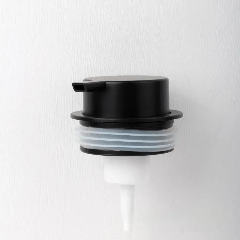 Foam pump facial cleanser dispenser with hand push mechanism in metallic finish