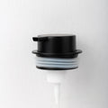 Foam pump facial cleanser dispenser with hand push mechanism in metallic finish