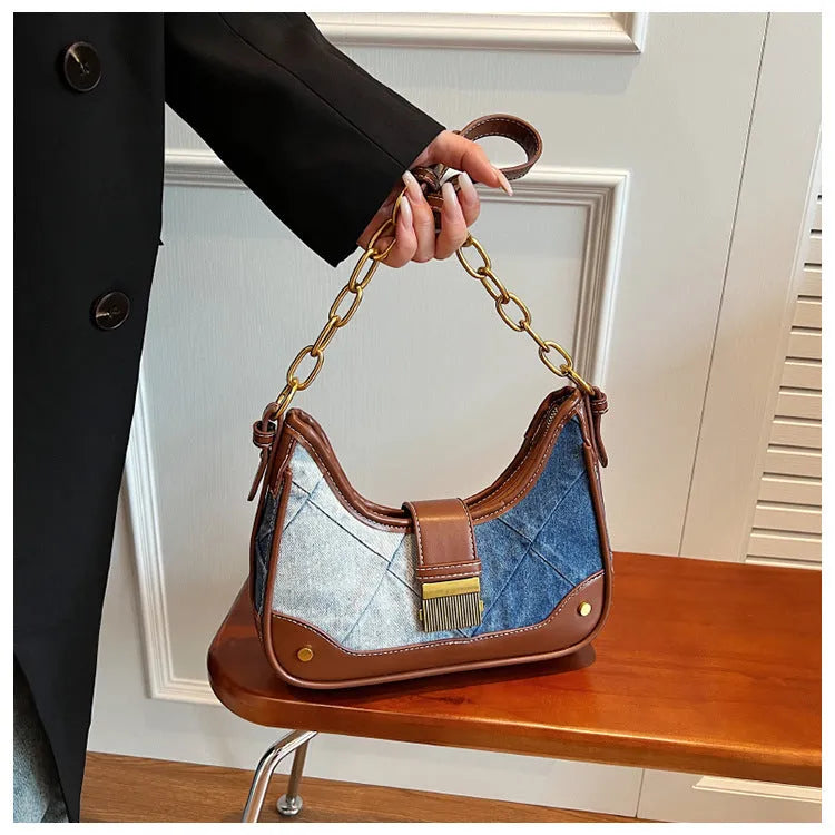 Brown denim women's shoulder bag with diamond mesh and chain detail, bucket shape.