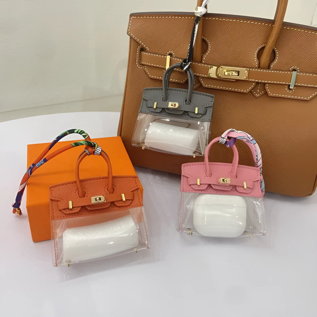 Women's artificial leather car key case showing examples of palm print and crocodile pattern designs.