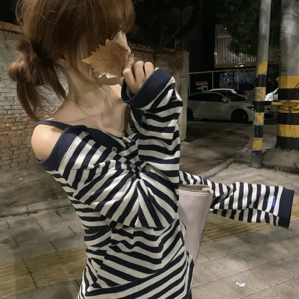 Dark blue women's oversized long-sleeved T-shirt with embroidery and stripes, laid flat.