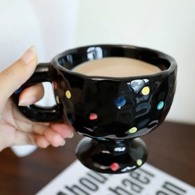 Handmade irregular solid colour ceramic mug on a table
