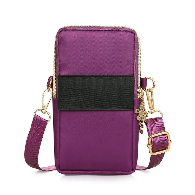 Nylon crossbody mobile phone bag with three zippered layers, card slots, and an adjustable strap in black