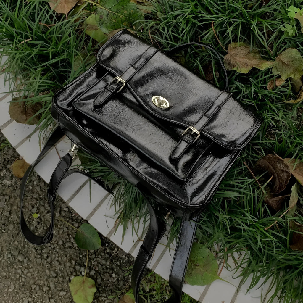 Black college style messenger bag with oil wax leather PU material showing dimensions 35x11x20cm