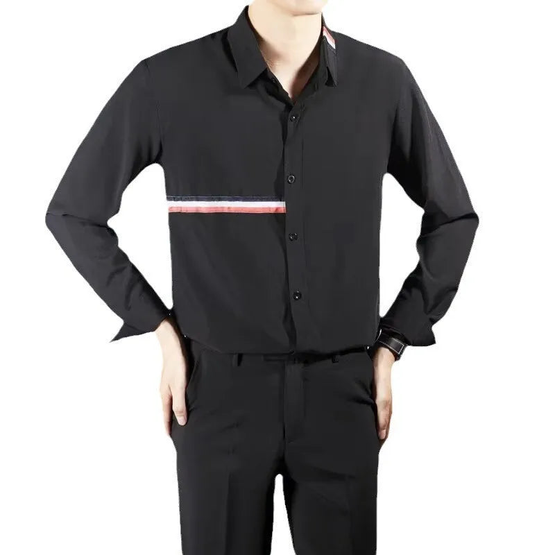 Man wearing a loose fit Hong Kong style casual shirt in a light blue cotton blend fabric.