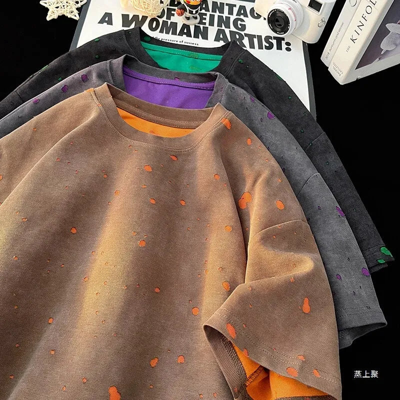 A man's loose fit ripped t-shirt in khaki colour with a round neck and short sleeves.
