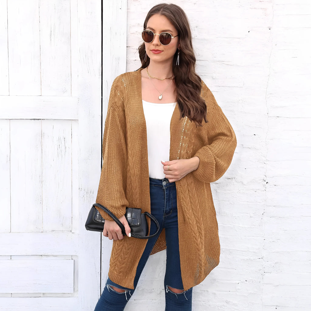 Women's longline loose acrylic sweater coat in army green colour, shown on a model.