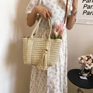 Women's straw crossbody shoulder bag in milky white colour with woven texture
