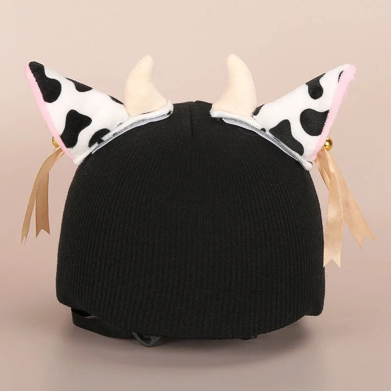 Soft plush cartoon character cover stretched over a pair of black on-ear headphones.