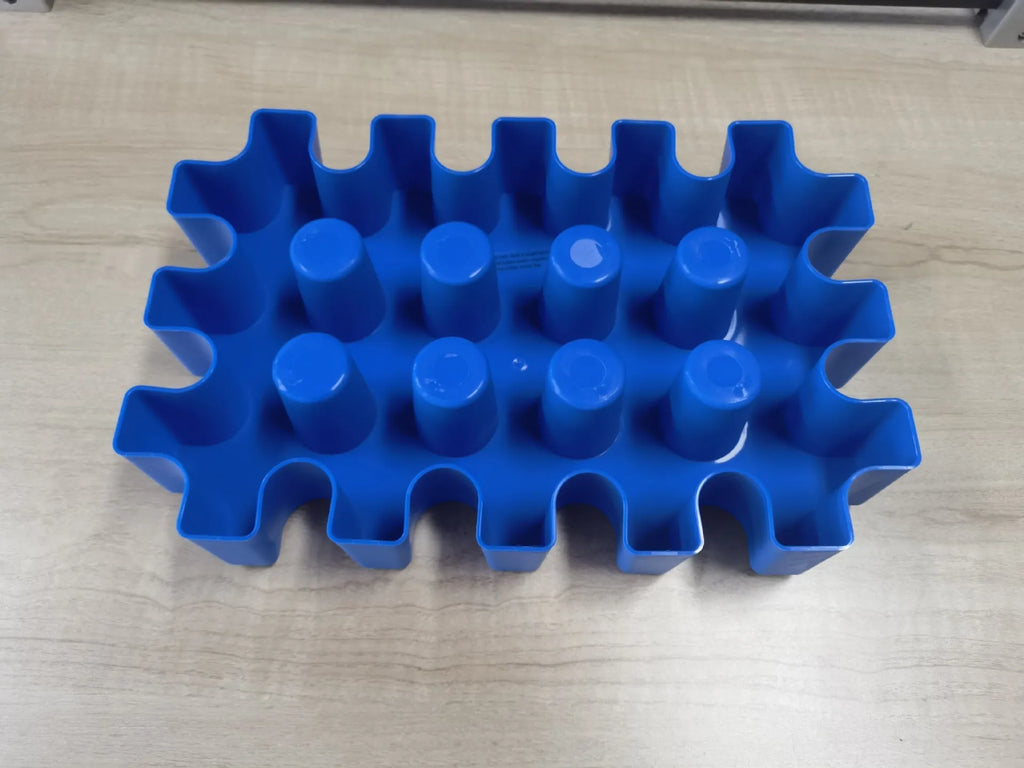 Blue plastic reusable ice block maker tray for outdoor coolers and camping.
