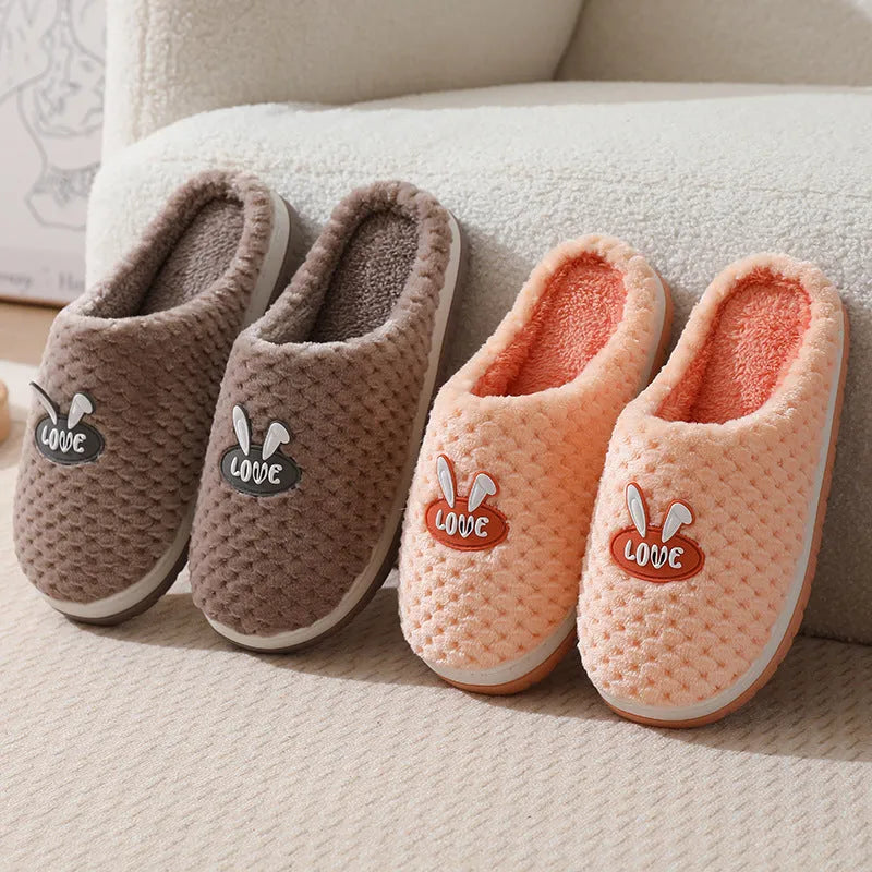 Rabbit plaid design women's plush slippers with anti-slip rubber soles in apricot colour.