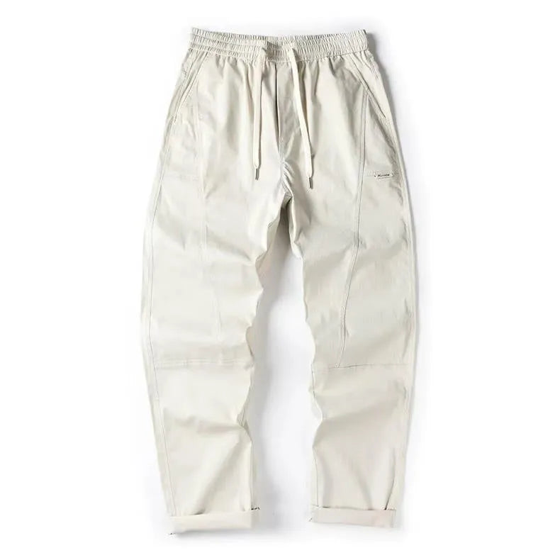 Cotton wide-leg casual trousers with elasticated waistband in black and milky white colours