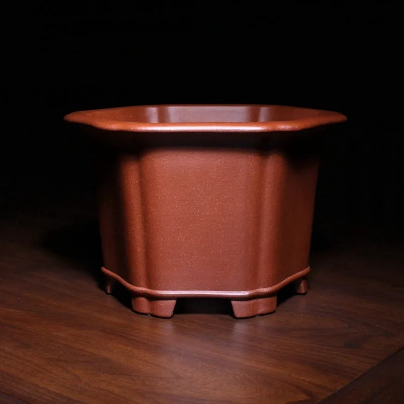 Square blue descending slope mud Zisha ceramic flowerpot on desktop with a plant