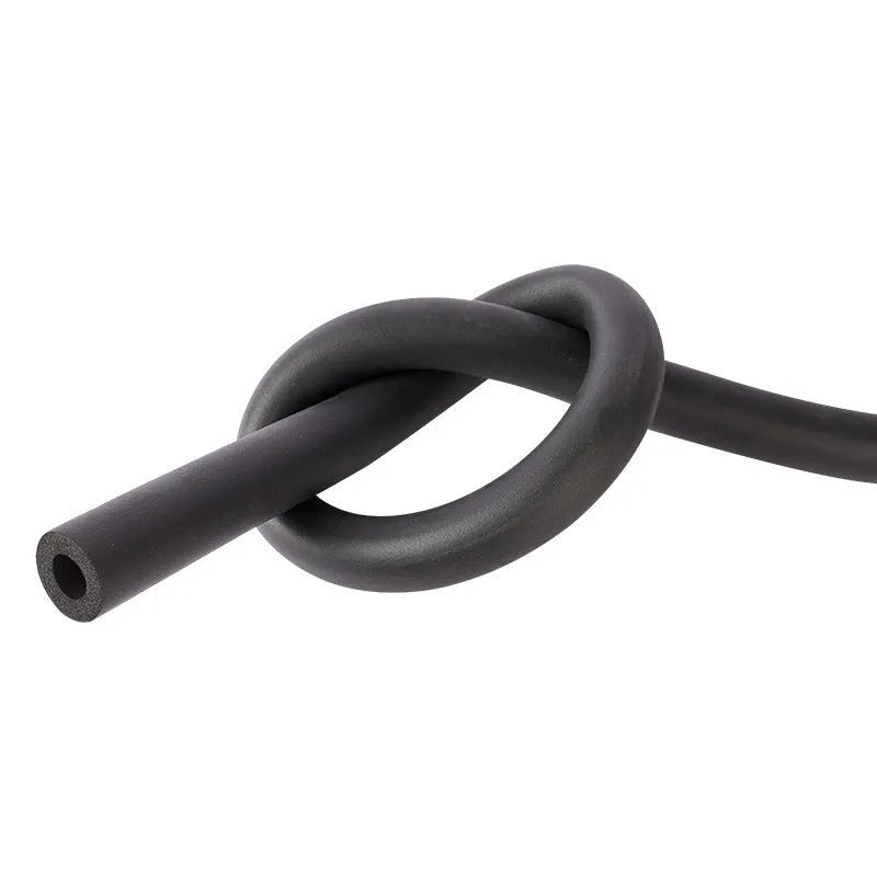 Self-adhesive rubber and plastic foam pipe insulation tube on a coil of pipe.